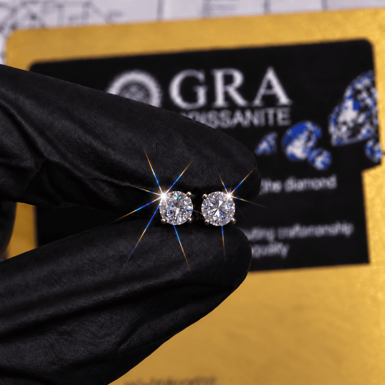 Round brilliant moissanite stud earrings held in front of a GRA certificate card